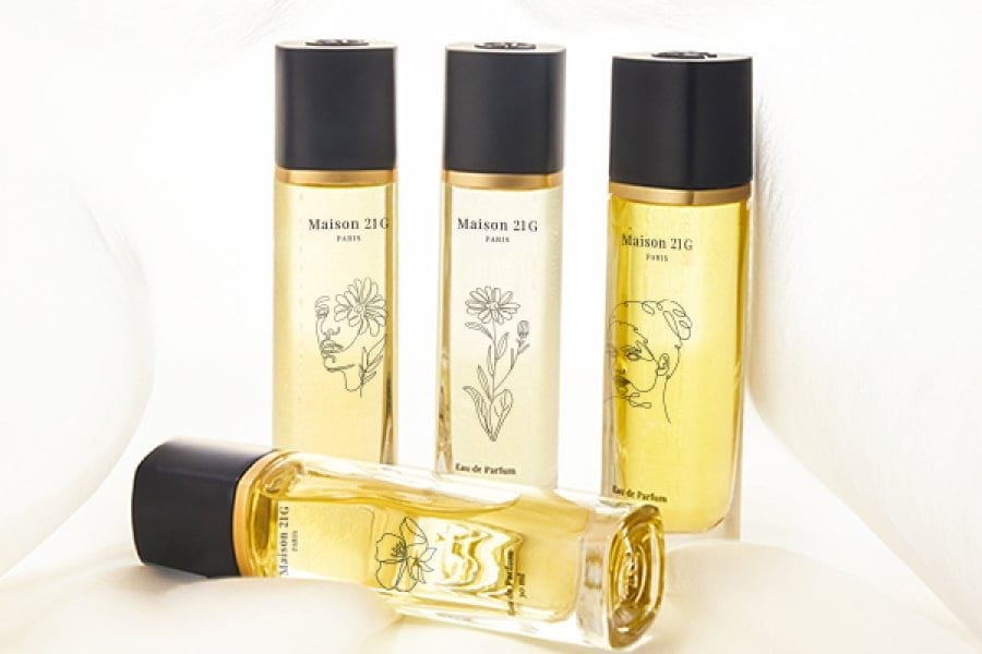 La Création bottles, each printed with a different design