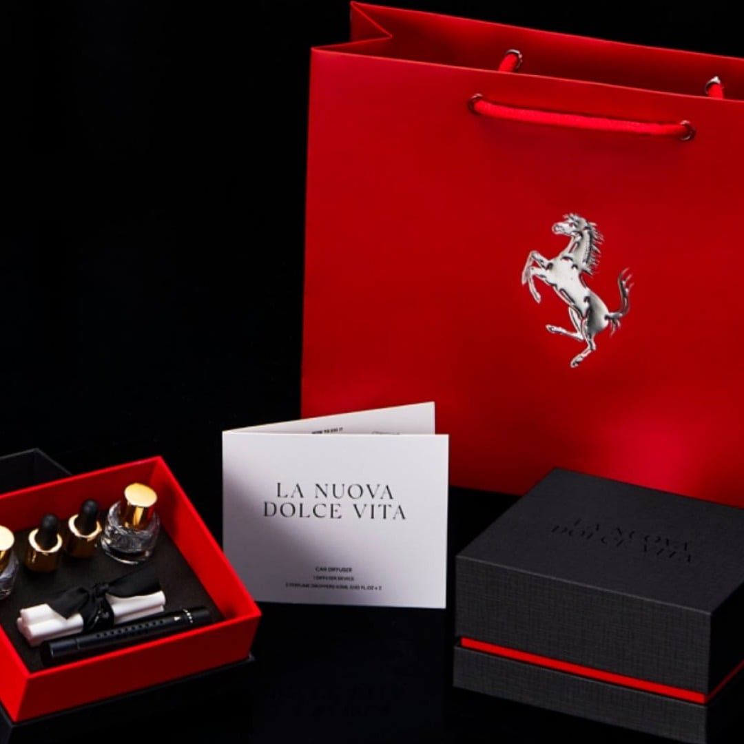 La Nuova Dolce Vita — a Ferrari coffret of perfume vials in a red and black case, with its gift bag.