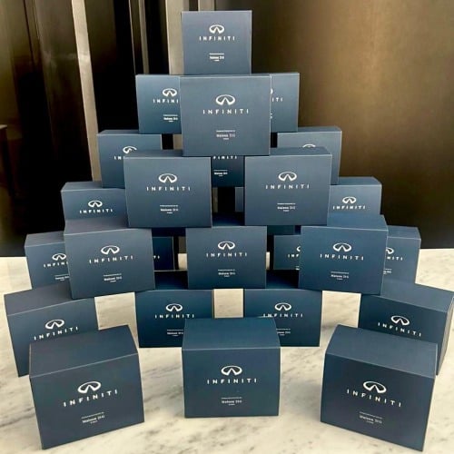 A pyramid of INFINITI gift boxes, each holding a bespoke scent.