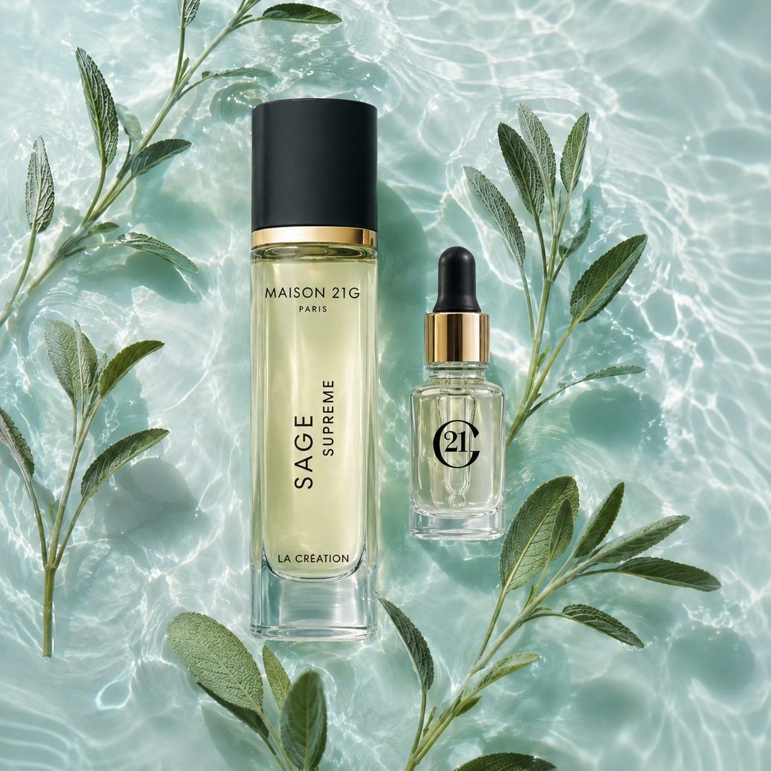 Sage Eau de Parfum and its Ocean Scent Magnifier among fresh Sage leaves on rippling turquoise water.